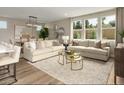 Bright living room featuring hardwood floors, recessed lighting, and a large window at 7394 Daly Grove St, Las Vegas, NV 89113
