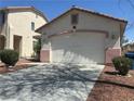Charming single-story home featuring a two-car garage and desert landscaping at 8042 Palace Monaco Ave, Las Vegas, NV 89117