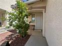 Inviting front porch with a bench, offering a cozy and shaded entrance at 8042 Palace Monaco Ave, Las Vegas, NV 89117