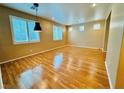 Spacious living room with gleaming wood floors and bright natural light at 9100 Hombard Ave, Las Vegas, NV 89148