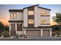 Modern two-story home with neutral stucco, brown trim, and a two-car garage showcasing an eye-catching facade at 10236 Rosemont Hills St, Las Vegas, NV 89141