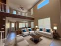 Bright living room with high ceilings, a loft overlook, comfortable furnishings and plenty of natural light at 1177 Twinkling Meadows Dr, Henderson, NV 89012