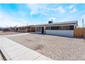 Cozy one-story home featuring a minimal front yard and fresh exterior paint at 1648 J St, Las Vegas, NV 89106