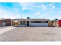 Inviting single-story home with a well-maintained gravel yard and clean exterior at 1648 J St, Las Vegas, NV 89106