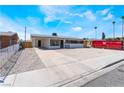 Lovely one-story home with a simple gravel front yard and a freshly painted exterior at 1648 J St, Las Vegas, NV 89106