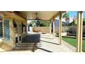 Inviting covered patio with ceiling fans offers a great outdoor living space at 2140 Desert Peak Rd, Las Vegas, NV 89134