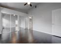 A bedroom with sleek hard wood floors and an entrance to the bathroom at 2305 W Horizon Ridge Pkwy # 3921, Henderson, NV 89052