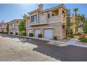 Beautifully landscaped condo building with attached garages and lush foliage at 251 S Green Valley Pkwy # 3222, Henderson, NV 89012