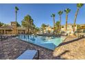 Resort-style pool area with tall palm trees and lounge chairs at 251 S Green Valley Pkwy # 3222, Henderson, NV 89012