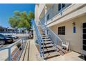 Exterior view of a staircase leading up to condos with blue railings and a nearby parking lot at 2725 S Nellis Blvd # 2036, Las Vegas, NV 89121