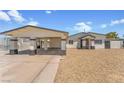 Charming single-story home featuring a carport, gated front yard, and desert landscaping at 2854 La Canada St, Las Vegas, NV 89169