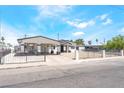 Charming single-story home featuring a carport, gated front yard, and desert landscaping at 2854 La Canada St, Las Vegas, NV 89169
