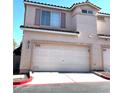 View of the home featuring a two-car garage with a light colored door at 39 Belle La Blanc Ave, Las Vegas, NV 89123