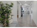 Bright entryway showcasing tiled floors, recessed lighting, and an open-concept design with natural light at 5234 Savannah Rose St, Las Vegas, NV 89149
