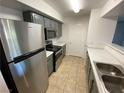 Efficient kitchen with stainless steel appliances, grey cabinets, and easy access at 555 E Silverado Ranch Blvd # 2030, Las Vegas, NV 89183