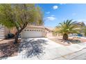 Charming two-story home with a two-car garage and desert landscaping at 7459 Aurora Glow St, Las Vegas, NV 89139