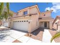 Charming two-story home with a two-car garage and desert landscaping at 7459 Aurora Glow St, Las Vegas, NV 89139