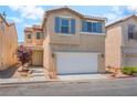 Two-story home with neutral stucco, matching shutters, a front yard, and a two car garage at 7553 Virginia Dale St, Las Vegas, NV 89131