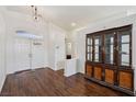 Bright entryway featuring hardwood floors, high ceilings and stylish lighting fixture at 7927 Villa Salsa Ave, Las Vegas, NV 89131