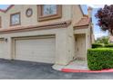 Close-up view of a townhome entrance with a private garage at 8301 Boseck Dr # 232, Las Vegas, NV 89145