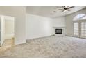 Bright living room featuring a fireplace and neutral carpet at 8301 Boseck Dr # 232, Las Vegas, NV 89145