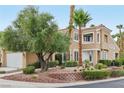 Charming two-story home with a well-maintained yard, mature trees, and a welcoming front entrance at 9900 Summer Ash Ct # 103, Las Vegas, NV 89134