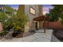 Private backyard with a covered patio, stone accents, and access to indoor/outdoor living at , Las Vegas, NV 89134