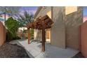 Private backyard with a covered patio, stone accents, and access to indoor/outdoor living at , Las Vegas, NV 89134