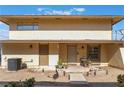 Inviting condo with a cozy front porch, desert landscaping, and a well-maintained facade at 1407 Dorothy Ave # 2, Las Vegas, NV 89119