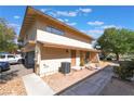 Desirable townhome showcasing private entrances, attached garages, and a neatly kept front yard at 1407 Dorothy Ave # 2, Las Vegas, NV 89119