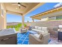 Cozy covered patio with comfortable seating and a built-in grill, perfect for entertaining at 163 Caraset Ln, Henderson, NV 89011