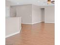 Open-concept living area with wood floors and neutral tones, perfect for entertaining at 2428 Hamonah Dr, Henderson, NV 89044