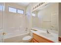 Clean bathroom with a tub and shower, large vanity mirror, and updated fixtures at 3025 Seaford Peak Dr, Henderson, NV 89052