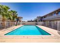 A refreshing community pool surrounded by lush palm trees, perfect for relaxation and recreation at 304 Orland St # 47, Las Vegas, NV 89107