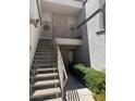 Exterior shot featuring stair access to apartments, showcasing secure entrances and well-kept landscaping at 3150 Soft Breezes Dr # 1167, Las Vegas, NV 89128