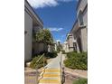 Inviting exterior view of building with landscaped pathways and lush surroundings in a well-maintained community at 3150 Soft Breezes Dr # 1167, Las Vegas, NV 89128