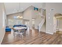 Spacious living room featuring soaring ceilings, hardwood floors and ample natural light at 3420 Lockport St, Las Vegas, NV 89129