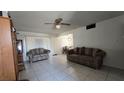 Inviting living room with tile flooring, comfortable seating, and a bright, airy feel at 5209 Del Monte Ave, Las Vegas, NV 89146