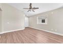 Bright living room with hardwood floors and neutral paint and a window to the outside at 5912 Kentlands St, Las Vegas, NV 89130