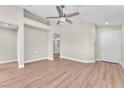 Bright living room with hardwood floors and neutral paint that leads to the entrance at 5912 Kentlands St, Las Vegas, NV 89130