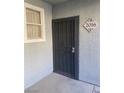 Secured front door with decorative ironwork and unit number 2016 at 6955 N Durango Dr # 2016, Las Vegas, NV 89149