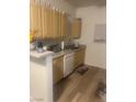 Functional kitchen features well-maintained cabinets and essential appliances at 6955 N Durango Dr # 2016, Las Vegas, NV 89149