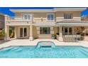 Gorgeous backyard pool and spa featuring built in bar and dining area at 712 Proud Eagle Ln, Las Vegas, NV 89144