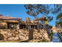 Back patio featuring a trellis, built in barbeque and plenty of space for outdoor lounging at 7201 Mission Hills Dr, Las Vegas, NV 89113
