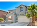 Well-maintained two-story home with attached garage, blue-gray facade, and a large palm tree at 9021 Rendon St, Las Vegas, NV 89143