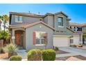 Inviting two-story home with a neutral facade, red tile roof, and a manicured front yard at 9021 Rendon St, Las Vegas, NV 89143
