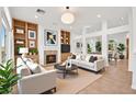 Bright living room featuring built-in shelves, fireplace, and stylish furniture for a cozy atmosphere at 10920 Grand Haven Ave, Las Vegas, NV 89134