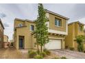 Charming two-story home featuring a well-manicured front yard and attached two-car garage at 113 Manzanita Falls Ave, North Las Vegas, NV 89031