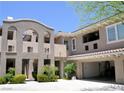Modern townhome with a private entrance, garage, and beautiful desert landscaping at 11830 Portina Dr # 2030, Las Vegas, NV 89138