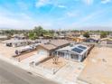 Single story home with a front yard, driveway, and solar panels in a suburban neighborhood at 1328 Balzar Ave, Las Vegas, NV 89106